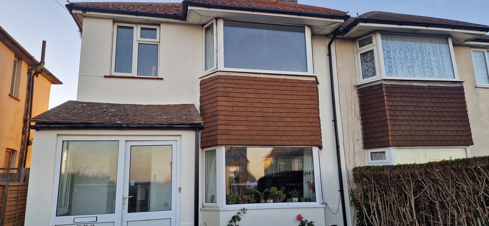 Freshly painted white render on the front of a semi-detached house in St Leonards-on-Sea